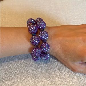 2 Stretchy purple beaded bracelets.